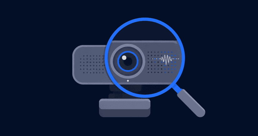 A laptop showing a video call self-preview with speaker, microphone and camera check indicators beside it